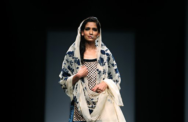 A model displays a creation by Vineet Bahl during the Wills Lifestyle India Fashion Week in New Delhi, India, Wednesday, March 13, 2013. (AP Photo/Tsering Topgyal)