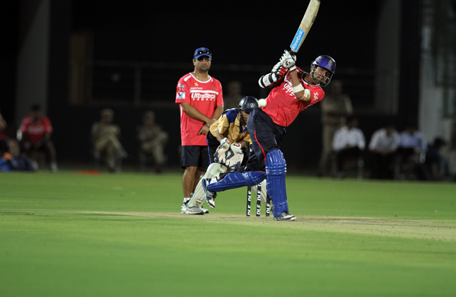 Ashok Menaria plays a shot during a night practice match at Sawai Mansingh Stadium in Jaipur on March 31, 2013.