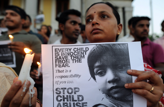 Activists of India Against Corruption protesting against recent Delhi rape incident in Bangalore on April 21, 2013. (Photo IANS)