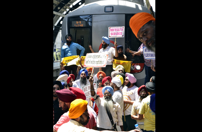 Victims of 1984 anti sikh riot protests at Subhash Nagar Metro Station demanding justice in New Delhi on May 1, 2013. (Photo IANS)