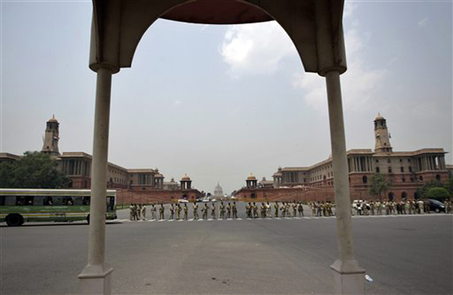 Indian police stand guard near the Presidential Palace during a protest against former parliamentarian Sajjan Kumar in New Delhi, India, Monday, May 6, 2013. An Indian court acquitted the ruling Congress party leader on Tuesday, April 30, of charges he incited mobs to kill Sikhs during the country's 1984 anti Sikh riots. (AP Photo/Tsering Topgyal)