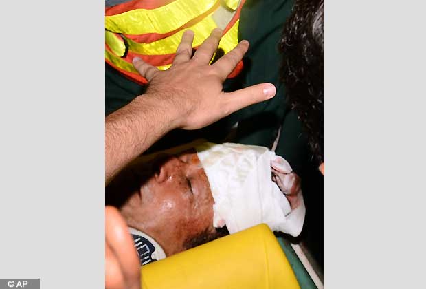 Rescue workers rush Imran Khan, Pakistan's cricket star turned politician to hospital in Lahore, Pakistan on Tuesday, May 7, 2013.