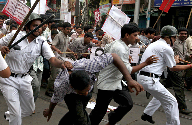 Kolkata Police lathicharge DSO activists during a rally to protest state goverment education policy in Kolkata on May 14, 2013. (Photo IANS)