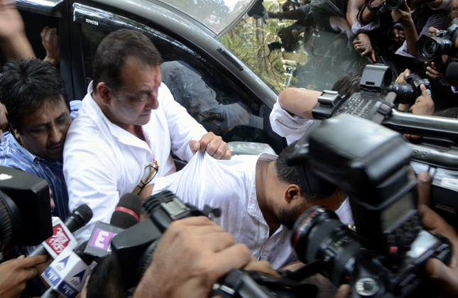 Bollywood actor Sanjay Dutt at the Tada court in Mumbai to surrender and undergo his prison term in the 1993 Mumbai blasts case. Dutt s vehicle was mobbed by hundreds of people making it difficult for his car to move forward.on May 16, 2013. (Photo Sandeep Mahankal/IANS)