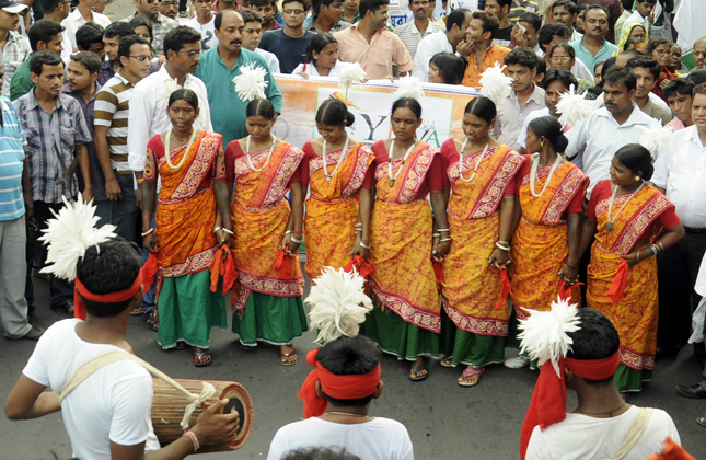 Tribals performing during a celebration rally on completion of two years of Trinamool Congress government in Kokata on May 19, 2013.(Photo IANS)
