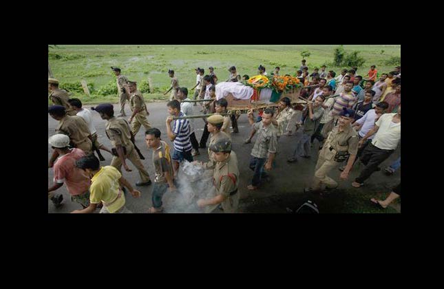 Villagers and colleagues carry the coffin of paramilitary soldier Dhrubajyoti Das who was killed in a rebel attack, at Dadara village, about 20 kilometers (12.5 miles) west of Gauhati, India, Thursday, July 1, 2010. Up to 200 Maoist rebels ambushed paramilitary troops in dense forest Tuesday evening in eastern India, killing at least 27 in the latest bold attack by the guerrillas, a senior police official said. Six paramilitary soldiers from Assam were killed in the attack. (AP Photo/ Anupam Nath)