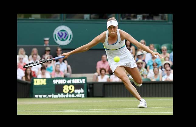 Russia's Vera Zvonareva runs to ake a forehand return during her quarterfinal match against Belgium's Kim Clijsters at the All England Lawn Tennis Championships at Wimbledon, Tuesday, June 29, 2010. (AP Photo/Anja Niedringhaus)