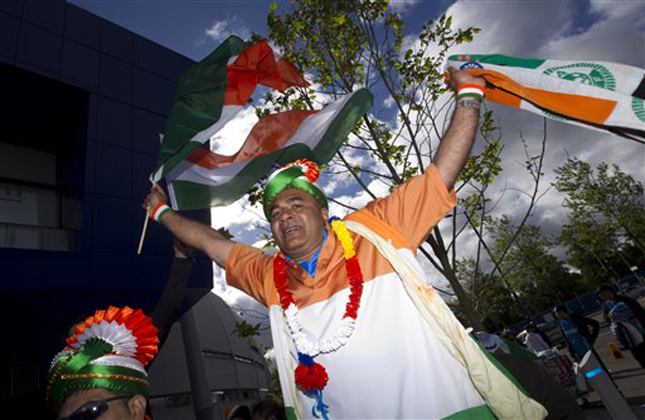 CORRECTS YEAR Cricket fans are seen outside the ground before India's ICC Champions Trophy cricket match against Pakistan at Edgbaston cricket ground, Birmingham, England, Saturday June 15, 2013. (AP Photo/Jon Super)