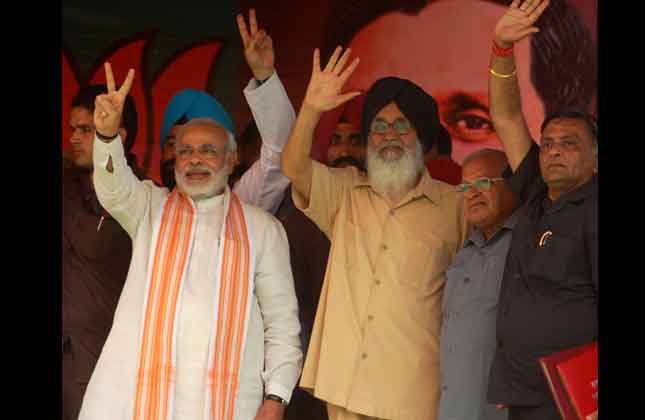 Gujarat Chief Minister Narendra Modi and Punjab Chief Minister Parkah Singh Badal and senior BJP leaders at BJP Sankalap Rally on the occasion of Dr. Shyama Prasad Mukherjee Martyr's Day at Madhopur in Punjab on June 23, 2013. (Photo IANS)