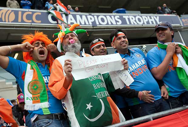 India fans appeal for rain to stay off before their team's ICC Champions Trophy Final cricket match against England at Edgbaston cricket ground, Birmingham, England, Sunday June 23, 2013.