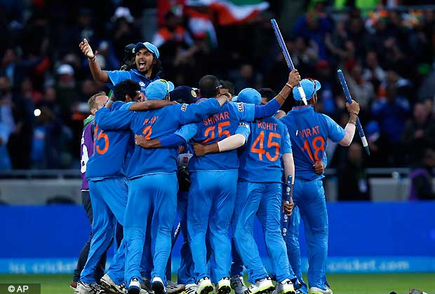 India's players celebrate their win against England at the end of their ICC Champions Trophy final cricket match at Edgbaston cricket ground in Birmingham, England, Sunday, June 23, 2013.