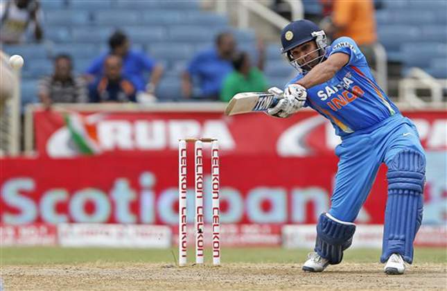 India's Rohit Sharma plays a shot during the Tri Nation Series cricket match against West Indies in Kingston, Jamaica, Sunday, June 30, 2013. (AP Photo/Andres Leighton)