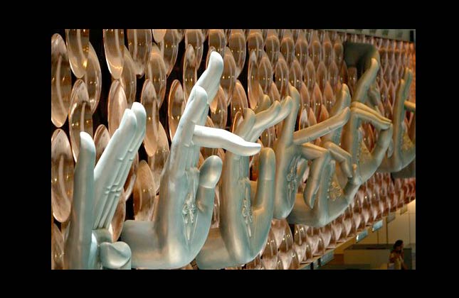 A detail of an installation depicting 'Mudras', or hand gestures used in Indian classical dance, is seen at the newly inaugurated Indira Gandhi International Airport Terminal 3 in New Delhi, India, Saturday, July 3, 2010. Top government officials unveiled a multibillion dollar, glittering steel and glass new airport terminal in the Indian capital Saturday months ahead of playing hosting to the Commonwealth Games. The ultramodern new terminal was built in just 37 months at a cost of nearly three billion dollars and will be ready for passengers on July 16. (AP Photo/Gurinder Osan)