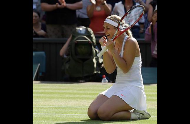 Sabine Lisicki of Germany reacts after defeating Agnieszka Radwanska of Poland during their Women's singles semifinal match at the All England Lawn Tennis Championships in Wimbledon, London, Thursday, July 4, 2013. AP Photo