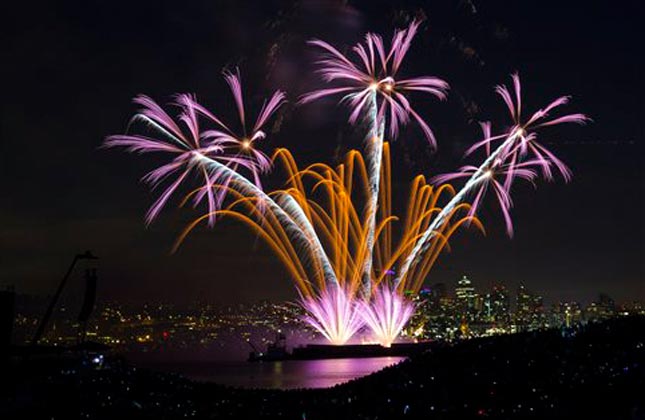 Fireworks explode over Lake Union during the Seafair Summer Fourth event Thursday, July 4, 2013, as seen from Gas Works Park in Seattle, Wash. AP Photo