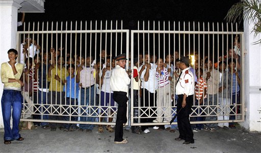 Security persons guard a gate to prevent people from entering a building where Indian cricket captain Mahendra Singh Dhoni is expected to get married in Dehradun, India, Sunday, July 4, 2010. According to local news reports, Dhoni is set to marry his girlfriend Sakshi Rawat at a private ceremony in the outskirts of Dehradun Sunday night.(AP Photo)