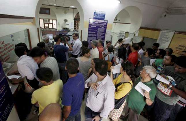 Indians queue up to send telegrams on the last day of the 163 year old service at a telegraph office in New Delhi, India, Sunday, July 14, 2013. AP Photo