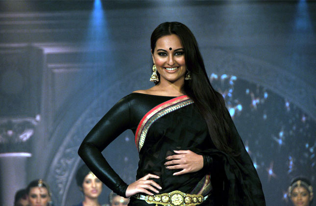 Bollywood Actress Sonakshi Sinha walks on the ramp during the Fashion show organized by Rajguru at Hotel Sheraton Brigade , in Bangalore on July 23, 2013. (Photo IANS)