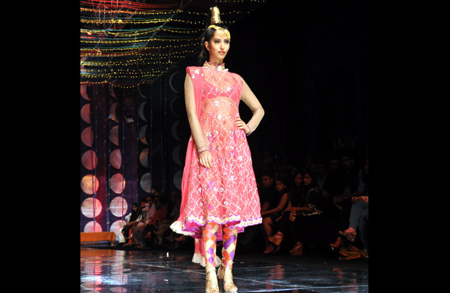 Model showing Rina Dhaka's collection at Indian Bridal Fashion Week 2013.