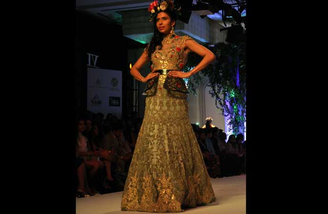 Models showcasing collections of designers Falguni and Shane Peacock at Indian Bridal Fashion Week in New Delhi, 25 July.