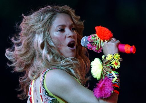 Colombian pop star Shakira, center stage, performs during the closing ceremony ahead of the World Cup final soccer match between the Netherlands and Spain at Soccer City in Johannesburg, South Africa, Sunday, July 11, 2010. (AP Photo/Luca Bruno)