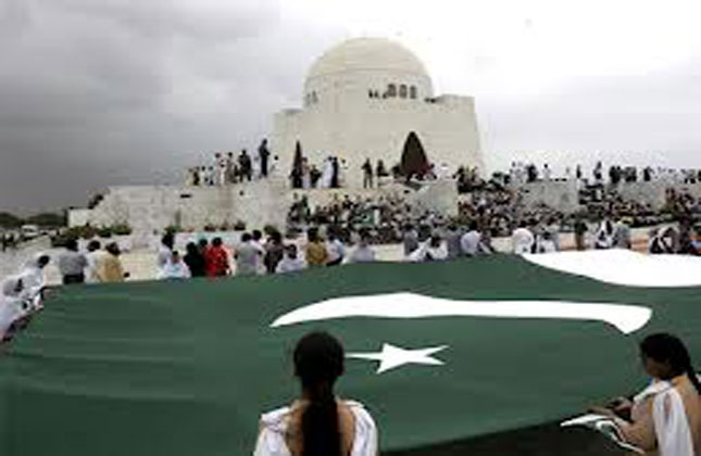 Students hold a huge Pakistani flag at mausoleum of Mohammad Ali Jinnah, the founder of Pakistan to mark Independence Day, in Karachi, Pakistan as Pakistan celebrates its 67th Independence Day. AP Photo