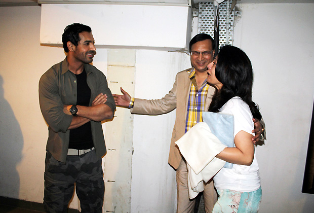 John Abraham is seen sharing a light moment with designer Ritu Beri at the screening of Madras Cafe.