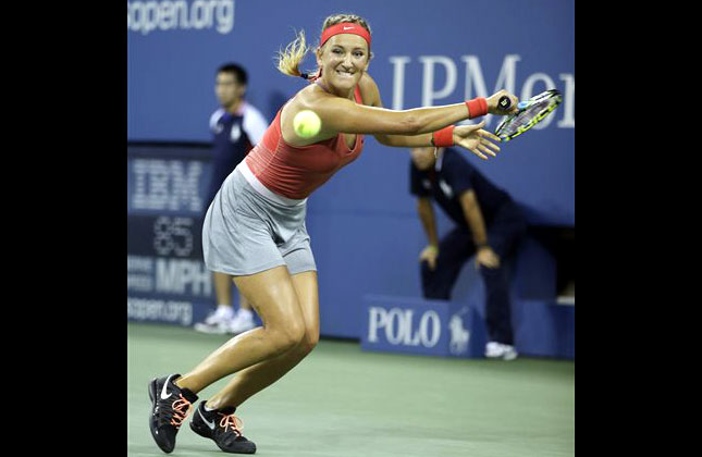 Belarus's Victoria Azarenka returns a shot to Germany's Dinah Pfizenmaier during the first round of the U.S. Open tennis tournament in New York. (AP Photo)