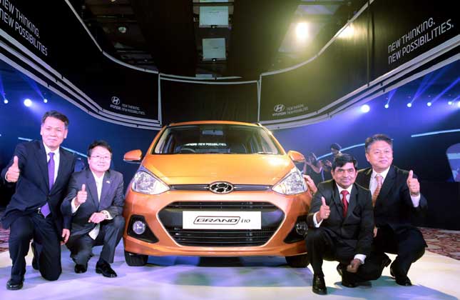 Passenger car manufacturer Hyundai Motor has launched its premium entry level hatchback Grand i10 in petrol and diesel variants with a launch price of Rs.4.29 lakh onwards. Seen at the launch event are Hyundai Motor India Ltd (HMIL) Managing Director &amp; CEO B S Seo Joongyu Lee, Ambassador of Republic of Korea Rakesh Srivastava Sr. VP, Sales &amp; Marketing CH Han, senior executive director at Hyundai Motors India.