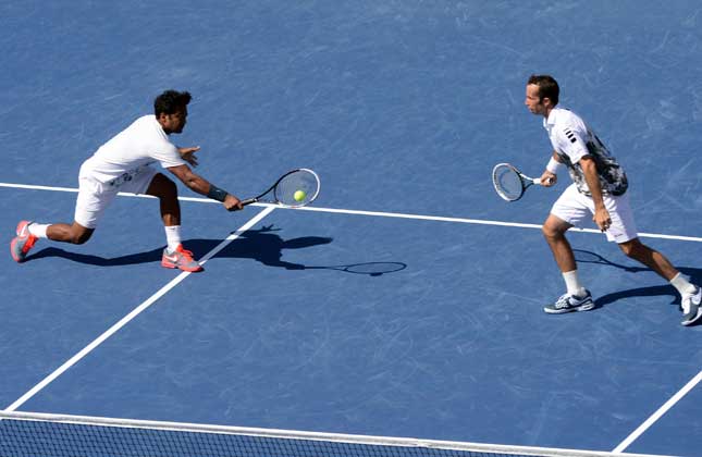 Leander Paes of India and Radek Stepanek of the Czech Republic celebrate after the men's doubles final against Alexander Peya of Austria and Bruno Soares of Brazil at the U.S. Open tennis championships in New York, the United States, Sept. 8, 2013. Paes and Stepanek won the match 2 0. (IANS)