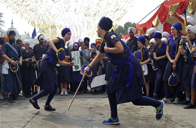 American Sikh students from the Miri Piri Academy, a Cambridge affiliated international boarding school, perform Gatka or Sikh martial art during the eve of birth anniversary of Guru Ram Das in Amritsar. (AP Photo)