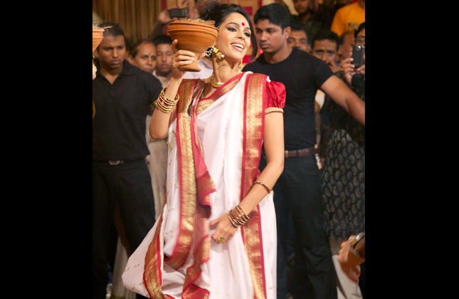 You must not have seen this face of Mallika ever. This is when she is celebrating Durga Puja.