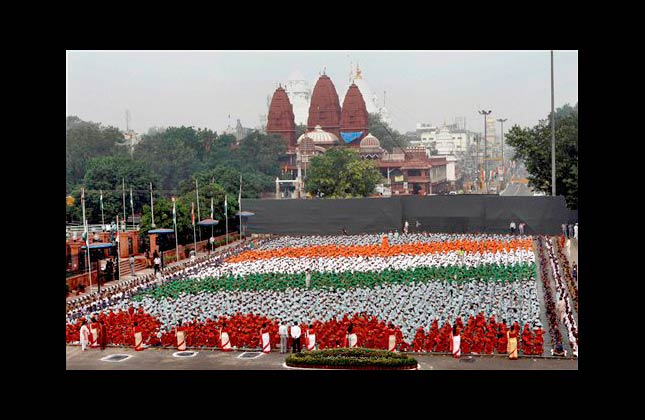 Indian schoolchildren wearing different colors form a representation of India's national flag during a dress rehearsal for Independence Day celebrations in New Delhi, India, Friday, Aug. 13, 2010. India will mark 63 years of independence on Sunday. (AP Photo)