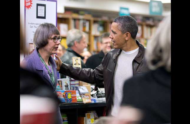 President Barack Obama greets a store employee at the local Politics and Prose bookstore in northwest Washington. (AP Photo)