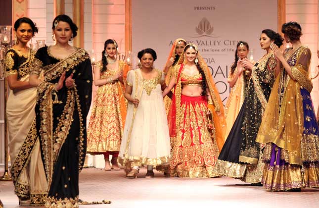 Bollywood divas have pulled their socks to glam up the fashion Bridal fashion week and grab all eyes as brides on the ramp. Actress Aditi Rao Hydari walked the ramp in a bright red lehenga.(Photo Vinod Singh)