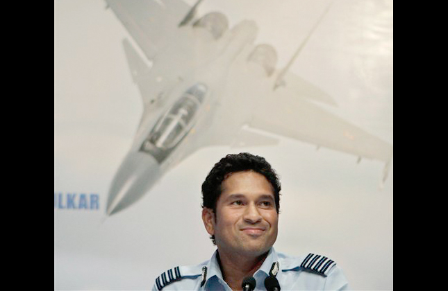 Indian cricketer Sachin Tendulkar smiles during a press conference after receiving the honorary rank of Group Captain of Indian Air Force in New Delhi, India, Friday, Sept. 3, 2010. (AP Photo/Anupam Nath)