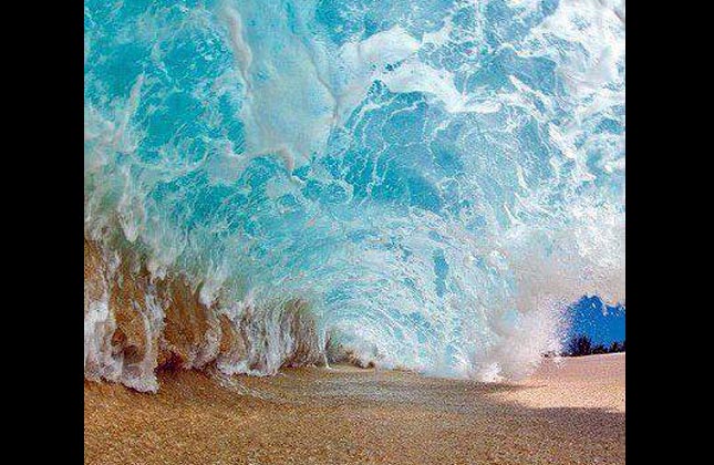 Creativity reflects in pictures, cannot speculate how the photographer shot the wave as it shows the wave from beneath it.