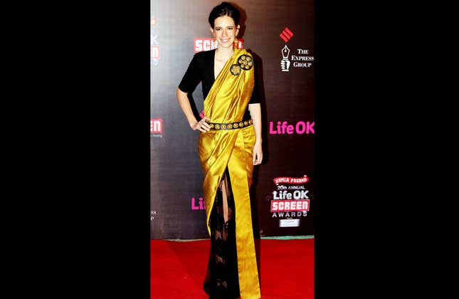 Fashionistas of the Bollywood industry get to show the best of their outfits at theses award functions. Here are the beauties who graced the traditional outfits rather than the ethnic outfits gracing them. Kalki Koechlin in a bright golden and black lehenga saree. A terrific combo and definitely she would not have any regrets to chose a traditional attire for the screen awards evening.