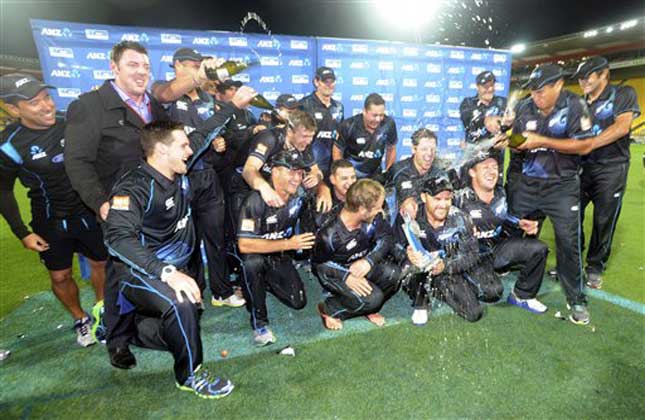 New Zealand cricket players celebrate their series' victory over India during the fifth one day International cricket match at Westpac Stadium in Wellington, New Zealand. (AP Photo)