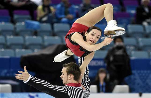 Kseria Stolbova and Fedor Klmovper from Russia perform their free program in the pairs event of the figure skating team event at the Iceberg Skating Palace during the 2014 Winter Olympics. (AP Photo)