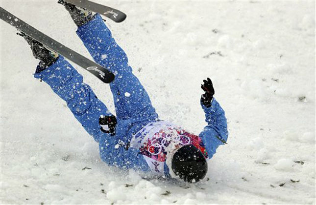 Dmitri Dashinski of Belarus crashes during men's freestyle skiing aerials training at the Rosa Khutor Extreme Park, at the 2014 Winter Olympics. (AP Photo)