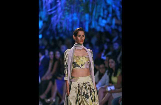 A model displays a creation by Indian designer Manish Malhotra during the opening day of Lakme Fashion Week in Mumbai, India, Tuesday, March 11, 2014.(AP)