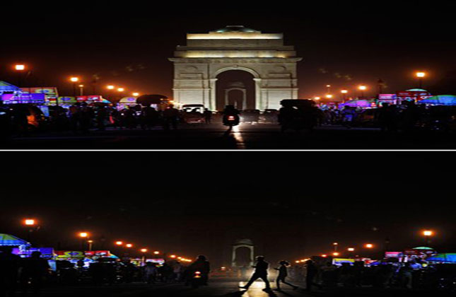 India Gate is seen lit in the above picture and then the same location in darkness when the lights are turned out for one hour to mark Earth Hour, in New Delhi, India. (AP Photo)