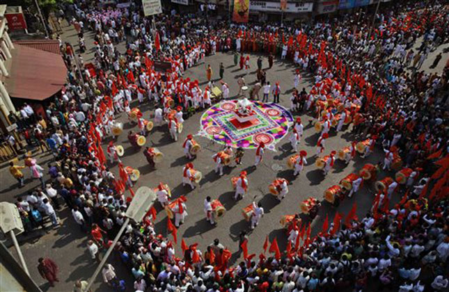 People dressed in traditional attire dance during a procession as they celebrate Gudi Padwa, or the Marathi new year, in Mumbai. (AP Photo)