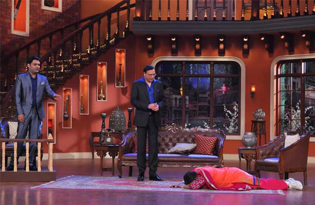 Palak at Rajat Sharma's feet for a break on television.