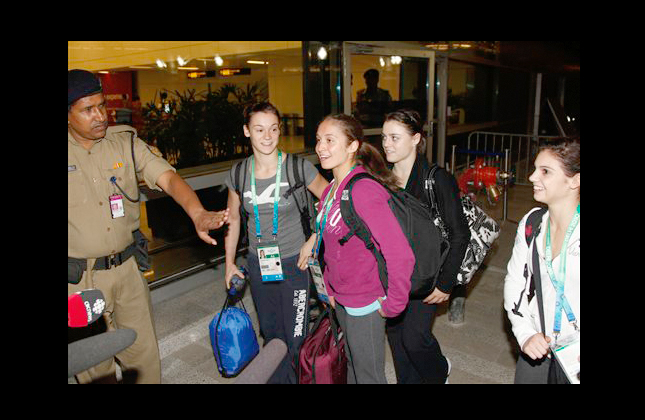 Members of the Canadian team arrive at the Indira Gandhi International Airport ahead of the Commonwealth Games in New Delhi, India, Monday, Sept. 27, 2010. Indian workers raced to finish preparations Monday for the Commonwealth Games as hundreds of athletes and team officials arrived in New Delhi. (AP Photo/ Mustafa Quraishi)