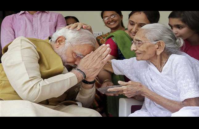 90 year old Hiraben blesses her son and India's next prime minister Narendra Modi at her home in Gandhinagar, in the western Indian state of Gujarat, Friday, May 16, 2014. (AP)