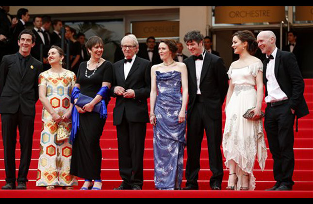 From left, writer Paul Laverty, actress Aisling Franciosi, actor Barry Ward, actress Simone Kirby, director Ken Loach, and Rebecca O'Brien stand at the top of the red carpet as they arrive for the screening of Jimmy's Hall at the 67th international film festival, Cannes, southern France, Thursday, May 22, 2014. (AP Photo)