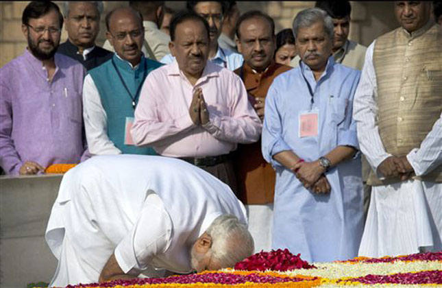 Would be PM Narendra Modi pays his respects at Rajghat, the memorial of Mahatma Gandhi, in New Delhi. (AP Photo)