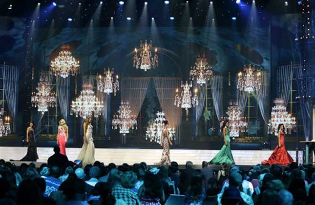 Participants parade onstage during the 2014 Miss USA preliminary competition in Baton Rouge, La.